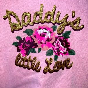 Pink “daddy’s little love” sweater.